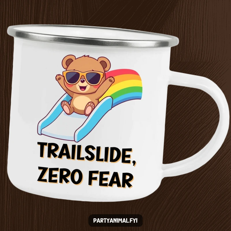 Funny camping mug featuring a bear in oversized sunglasses, joyfully sliding down a colorful rainbow slide, ready for outdoor fun.