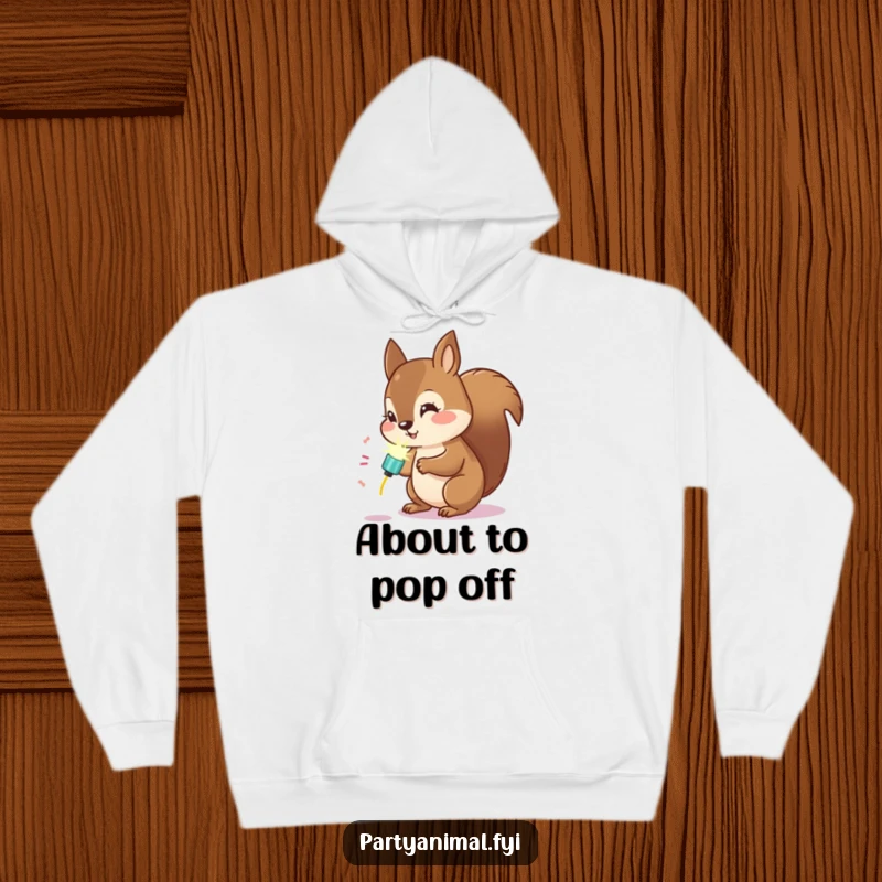 Funny Kawaii Squirrel Hoodie: Cute squirrel examining a glowing party popper, radiating warmth and curious energy.