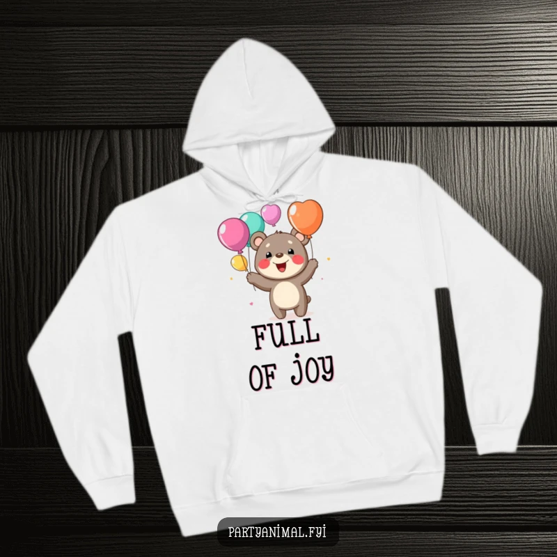 Funny hoodie with a happy bear character joyfully juggling colorful balloons, offering warmth and delightful humor.