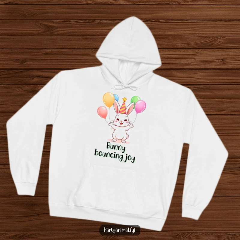 Cute bunny wearing a party hat, juggling colorful balloons, printed on a warm and funny hoodie for ultimate coziness.