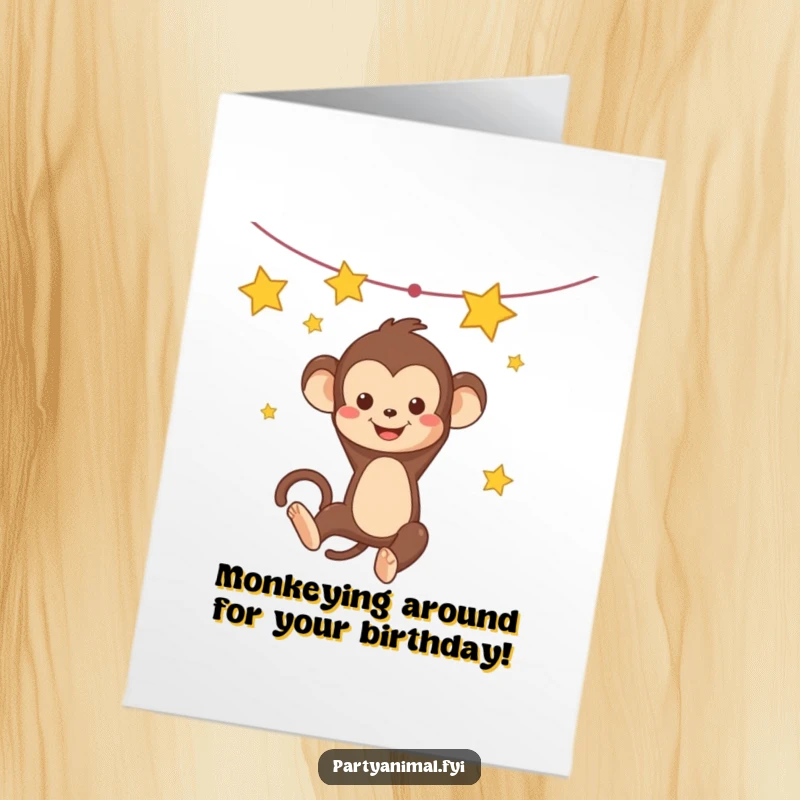 Funny Free Printable birthday card showing a Kawaii monkey happily swinging from a garland of twinkling stars, full of joy.