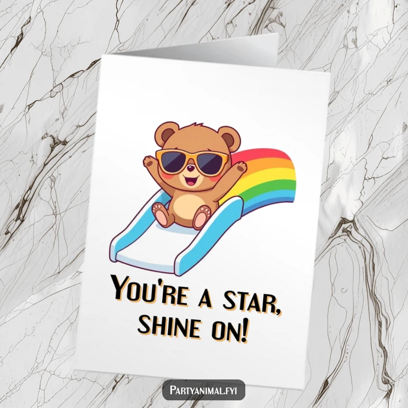 Funny free printable congratulations card of a bear with cool sunglasses gleefully sliding down a rainbow, conveying excitement and success.
