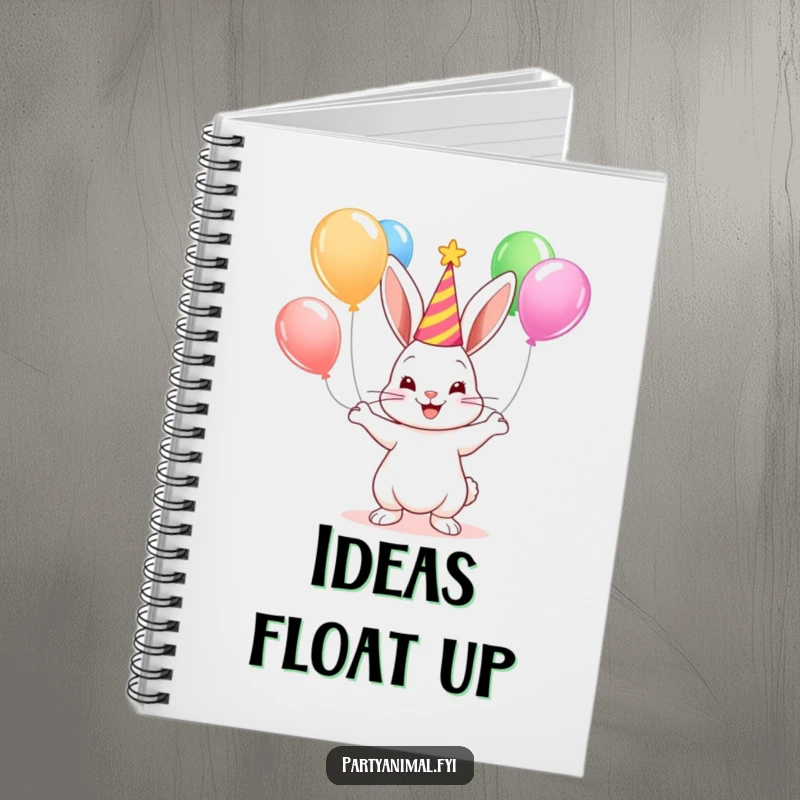 A cute bunny juggling balloons on the cover of a notebook, perfect for jotting down fun party plans.