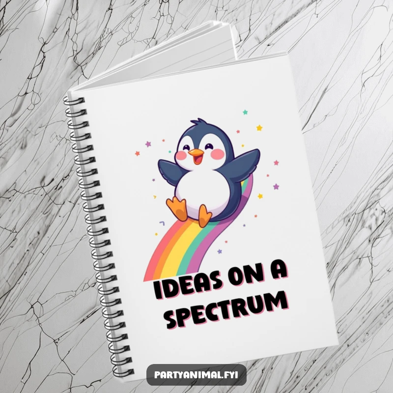 Funny gleeful penguin sliding down a rainbow with a confetti trail on a notebook, perfect for jotting down notes with whimsy, a funny gift.