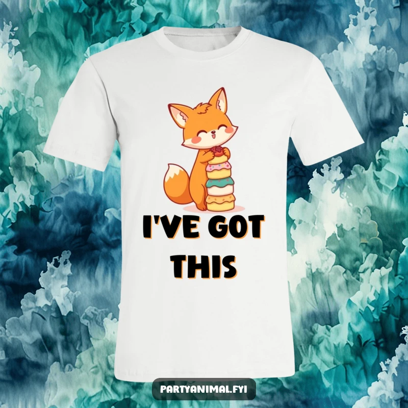 Funny t-shirt featuring a cute orange fox character balancing a tall stack of miniature cakes, looking proud and a little mischievous.