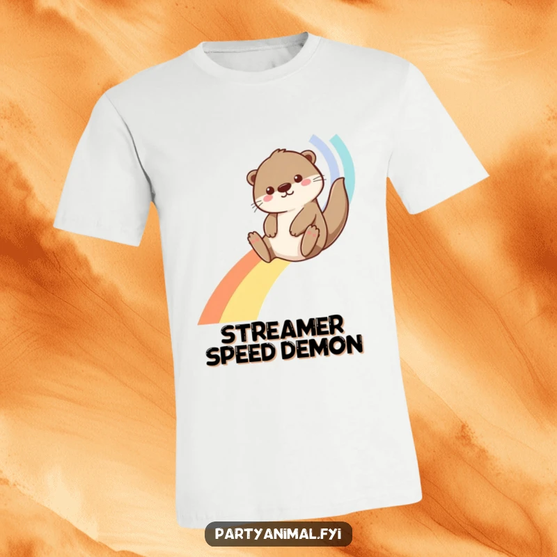 Funny Otter T-Shirt: An energetic otter joyfully slides down a bright rainbow constructed from flowing streamers, embodying fun and freedom.
