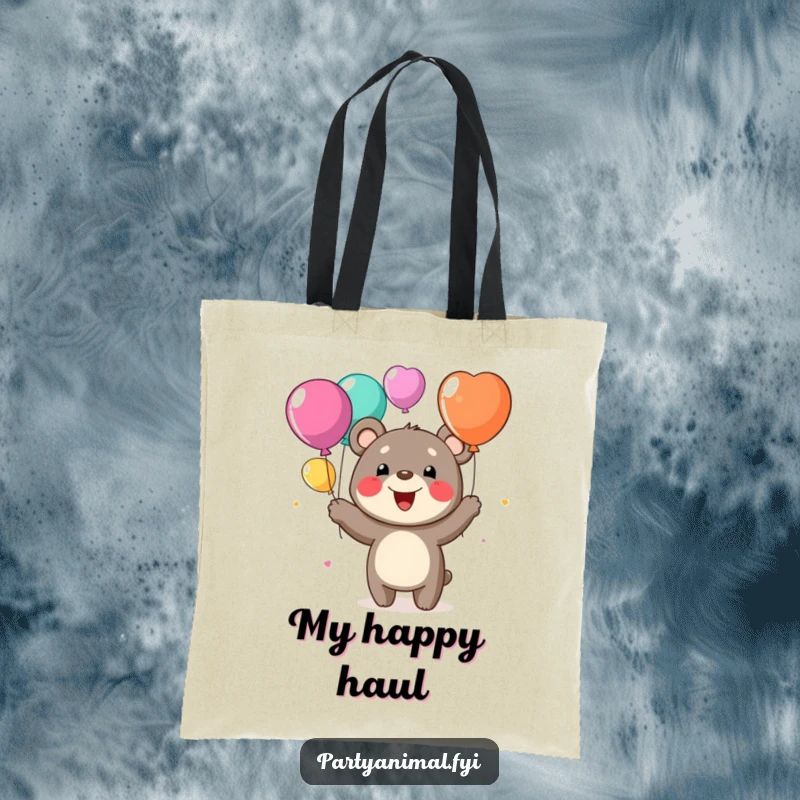 Funny tote bag showcasing a cheerful bear character with a huge grin, juggling colorful balloons, ideal for carrying daily items.